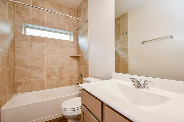 a bathroom with a bathtub and a sink