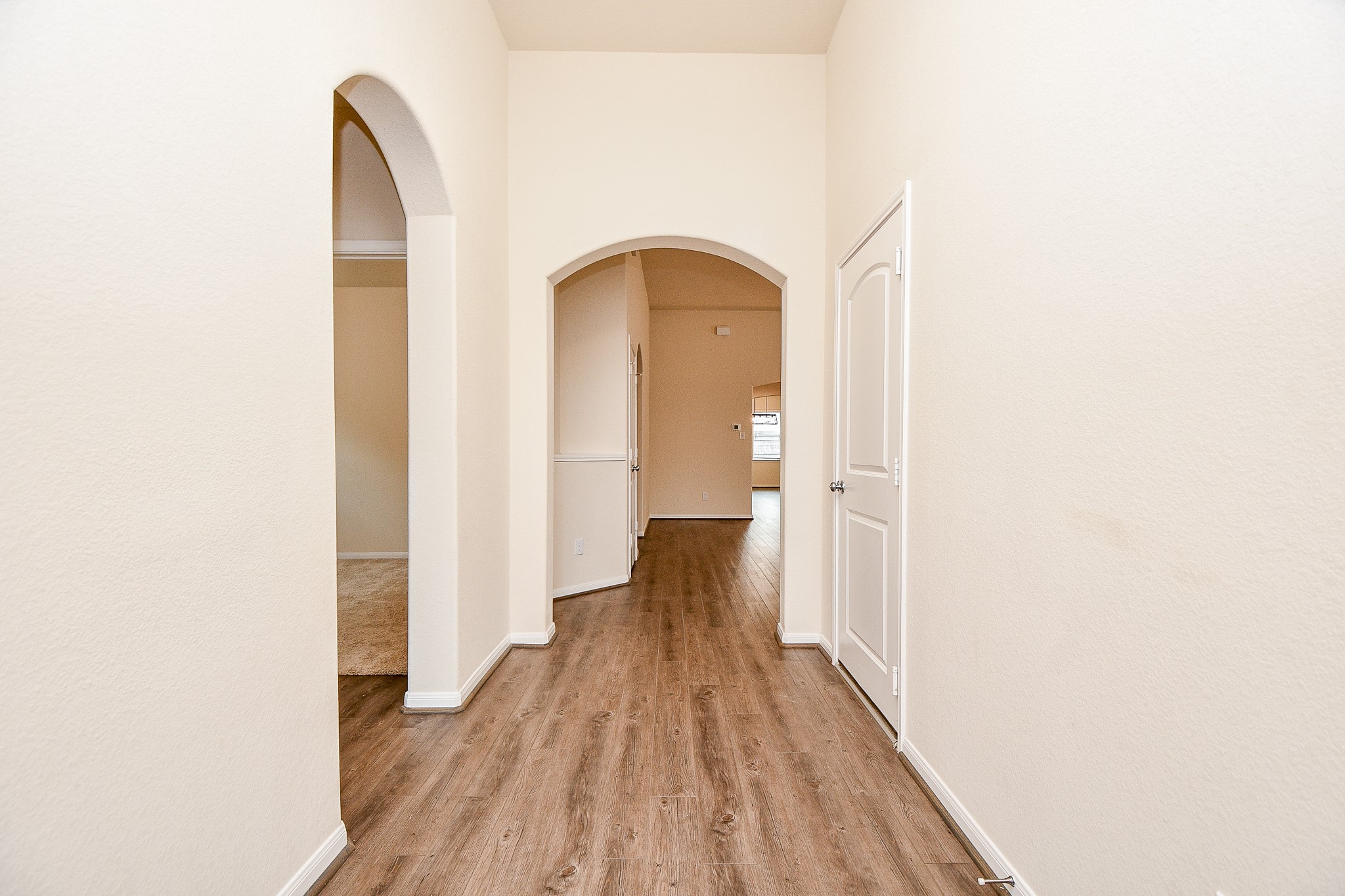 15210 Ordie Run Drive Humble, TX 77346 - Photo 3 of 40 a view of a hallway with wooden floor