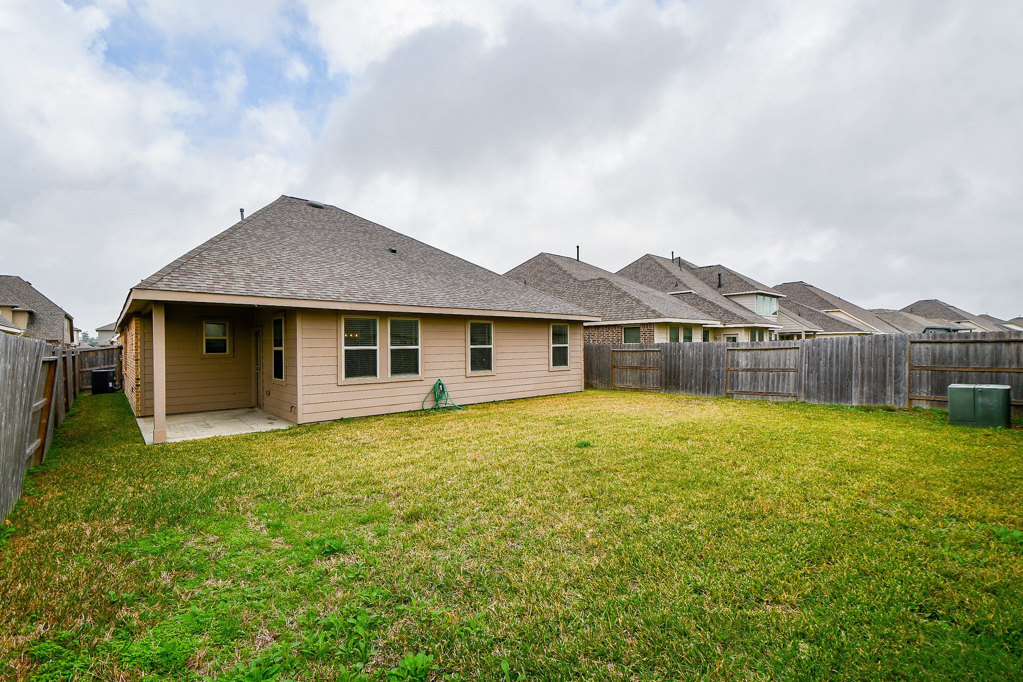 15210 Ordie Run Drive Humble, TX 77346 - Photo 38 of 40 a view of a house with a yard and sitting area