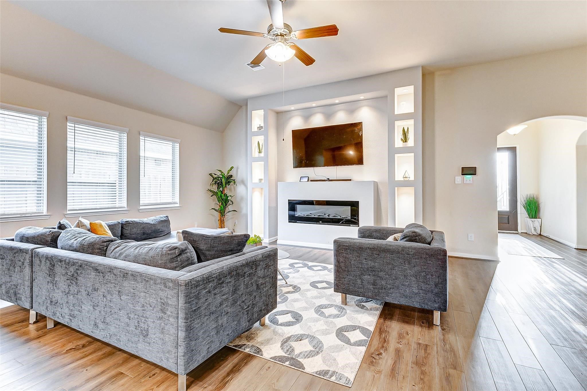 15210 Ordie Run Drive Humble, TX 77346 - Photo 4 of 40 a living room with fireplace furniture and a flat screen tv