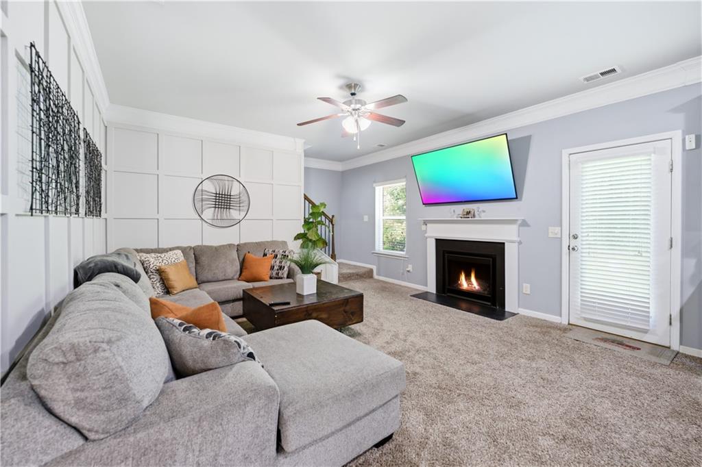 291 Boulder Run Hiram, GA 30141 - Photo 7 of 46 a living room with furniture a fireplace and a window