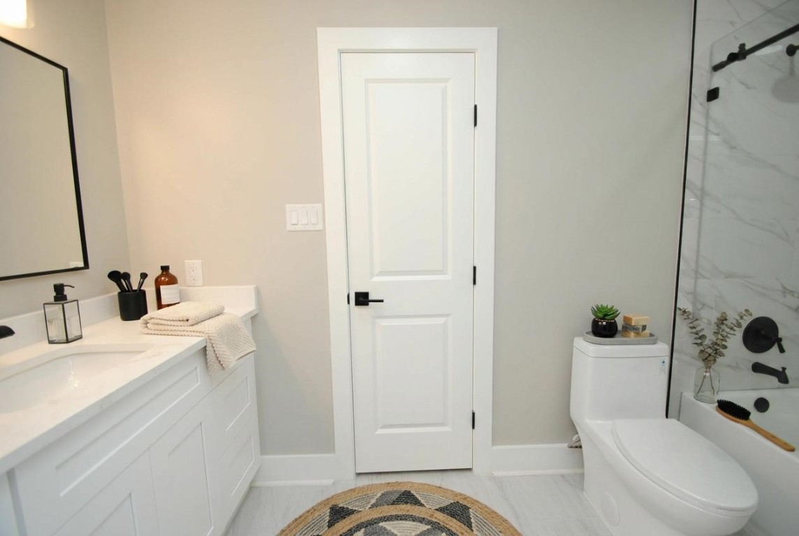 3322 Robinson Road Missouri City, TX 77459 - Photo 11 of 27 a bathroom with a sink a toilet and shower
