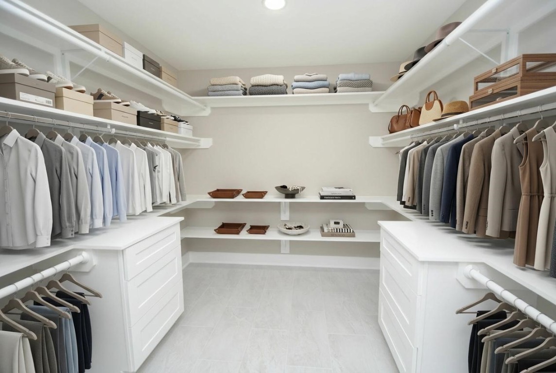 3322 Robinson Road Missouri City, TX 77459 - Photo 15 of 27 a view of walk in closet with clothes and shoes
