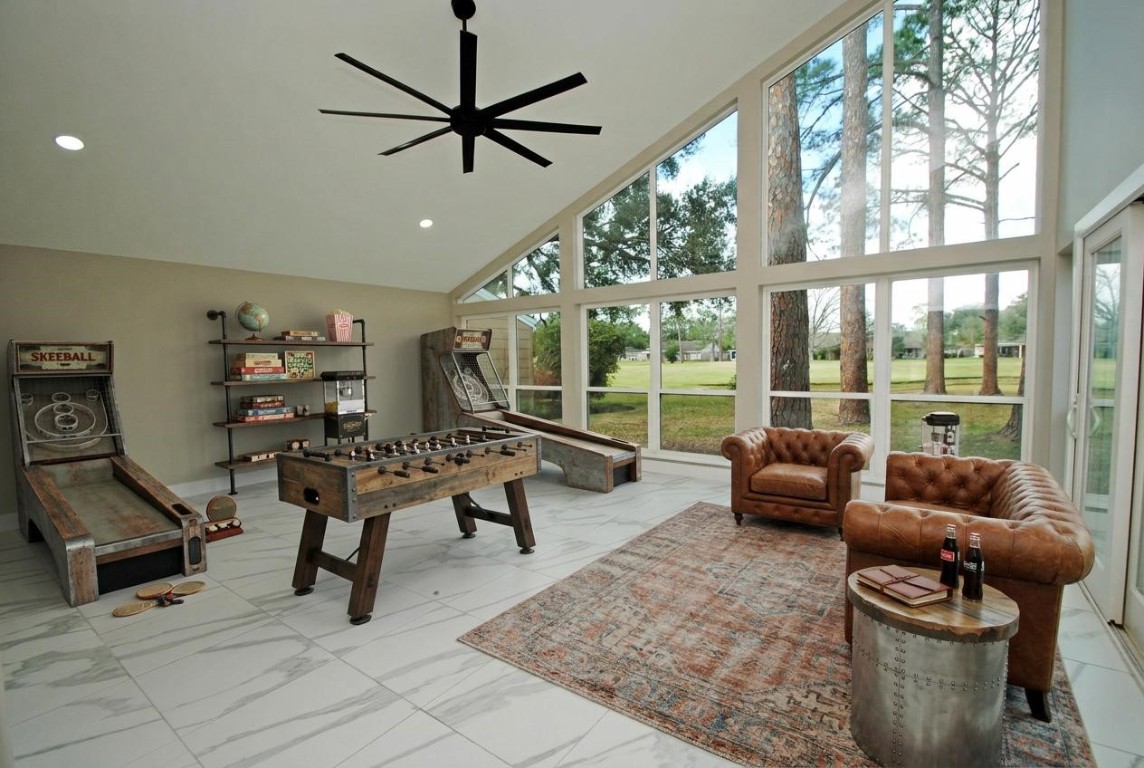 3322 Robinson Road Missouri City, TX 77459 - Photo 16 of 27 a living room with furniture and a floor to ceiling window