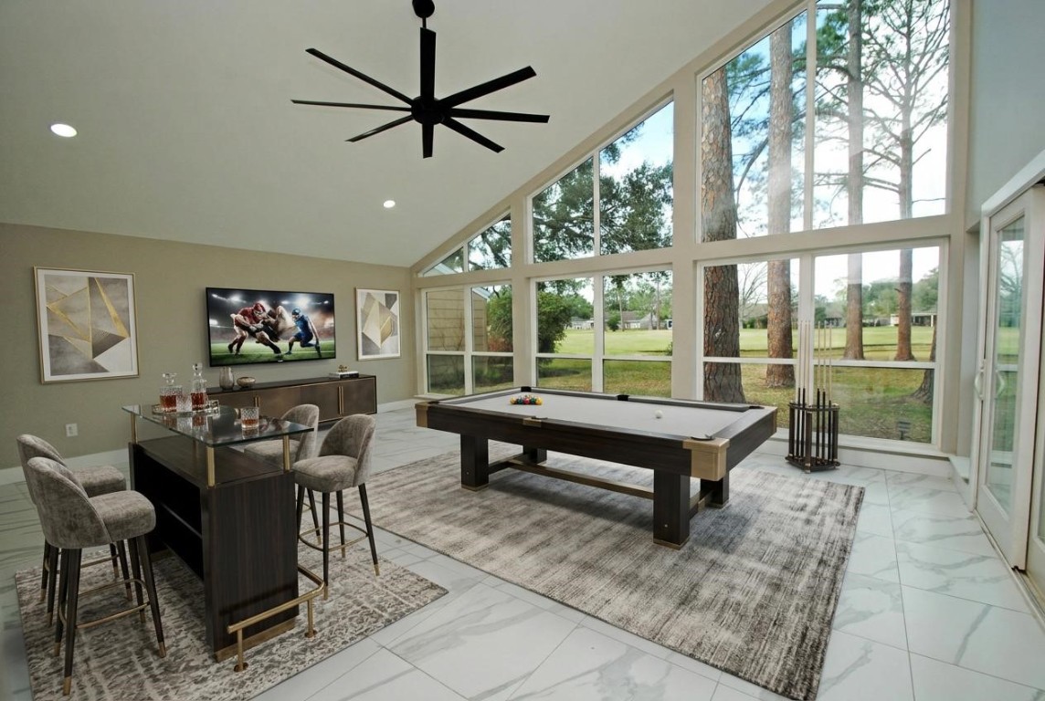 3322 Robinson Road Missouri City, TX 77459 - Photo 17 of 27 a living room with furniture a table and a large window