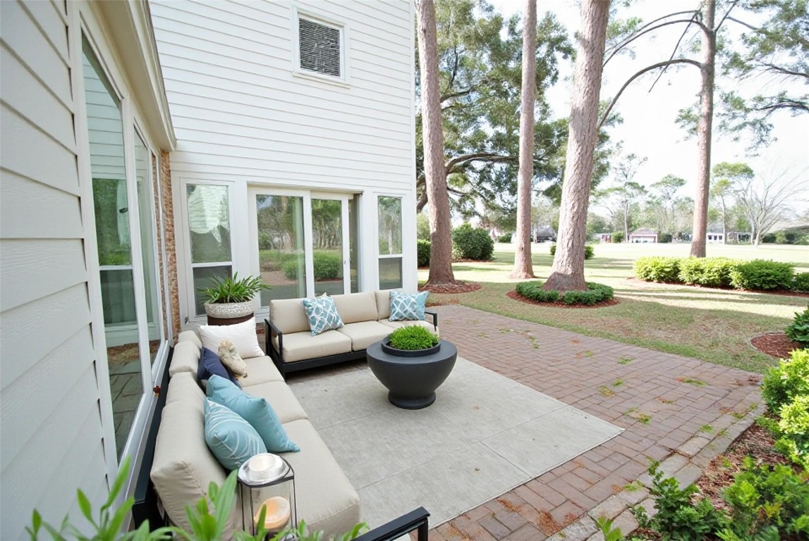 3322 Robinson Road Missouri City, TX 77459 - Photo 20 of 27 a view of a patio with couches and a potted plant on a table