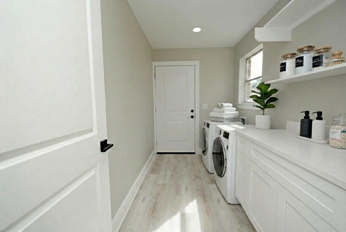 3322 Robinson Road Missouri City, TX 77459 - Photo 9 of 27 a bathroom with a sink a washer and dryer