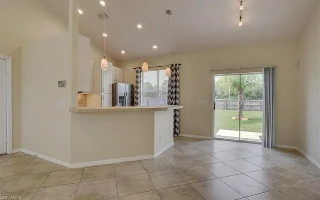 a view of a kitchen and window