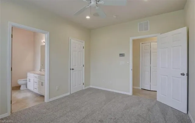 a view of a bathroom with white walls