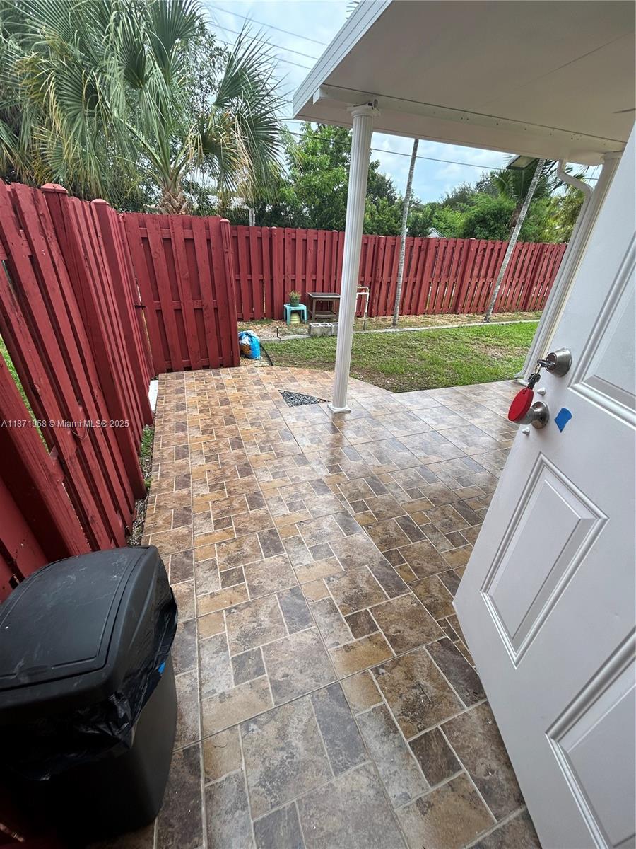 3219 Wilson Street Hollywood, FL 33021 - Photo 14 of 15 a view of a backyard with a swing