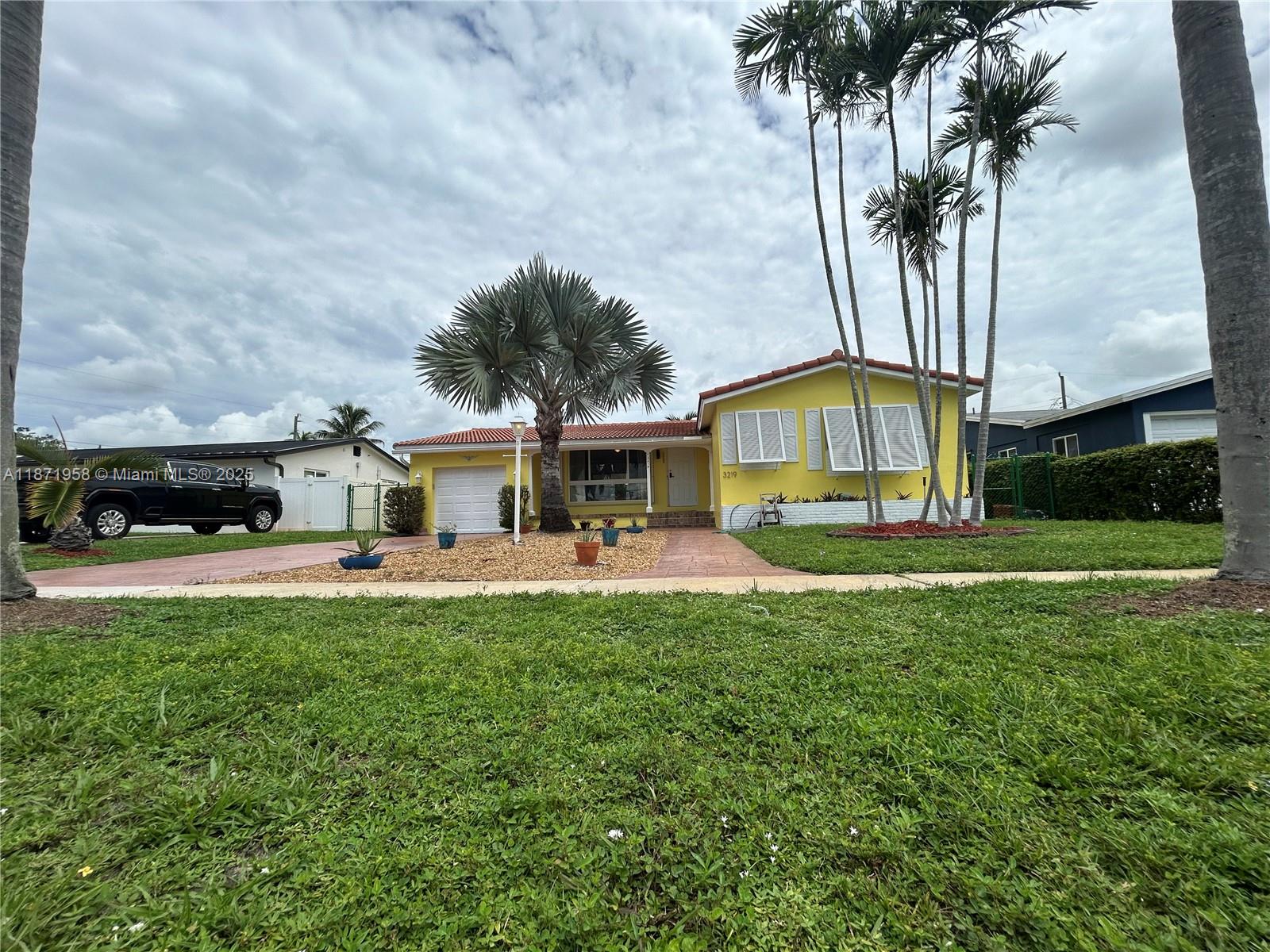 3219 Wilson Street Hollywood, FL 33021 - Photo 3 of 15 a view of house with outdoor space and swimming pool