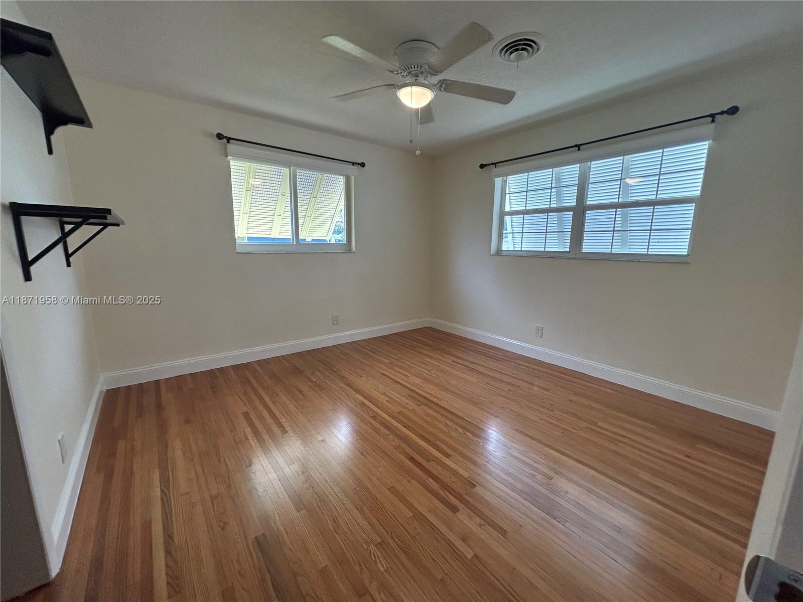 3219 Wilson Street Hollywood, FL 33021 - Photo 9 of 15 wooden floor in an empty room with a window