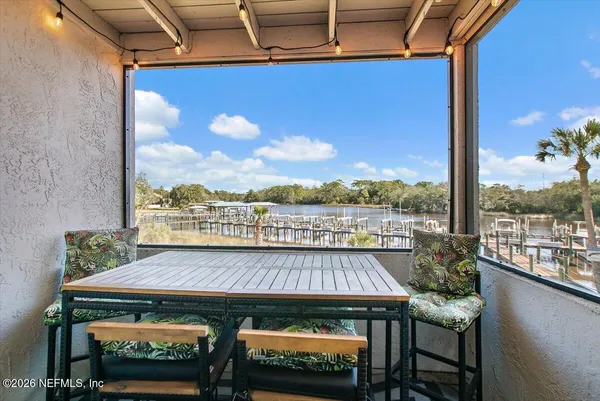a view of balcony with furniture and outdoor view