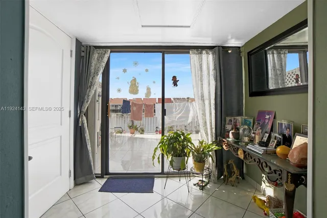 a room with patio outdoor dining table and chairs