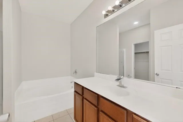 a bathroom with a shower and a bath tub