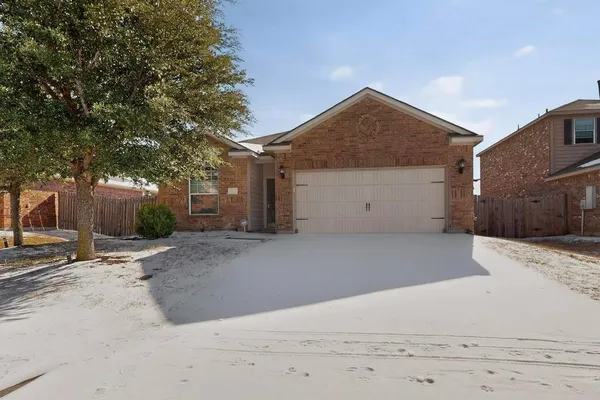 a view of garage and yard