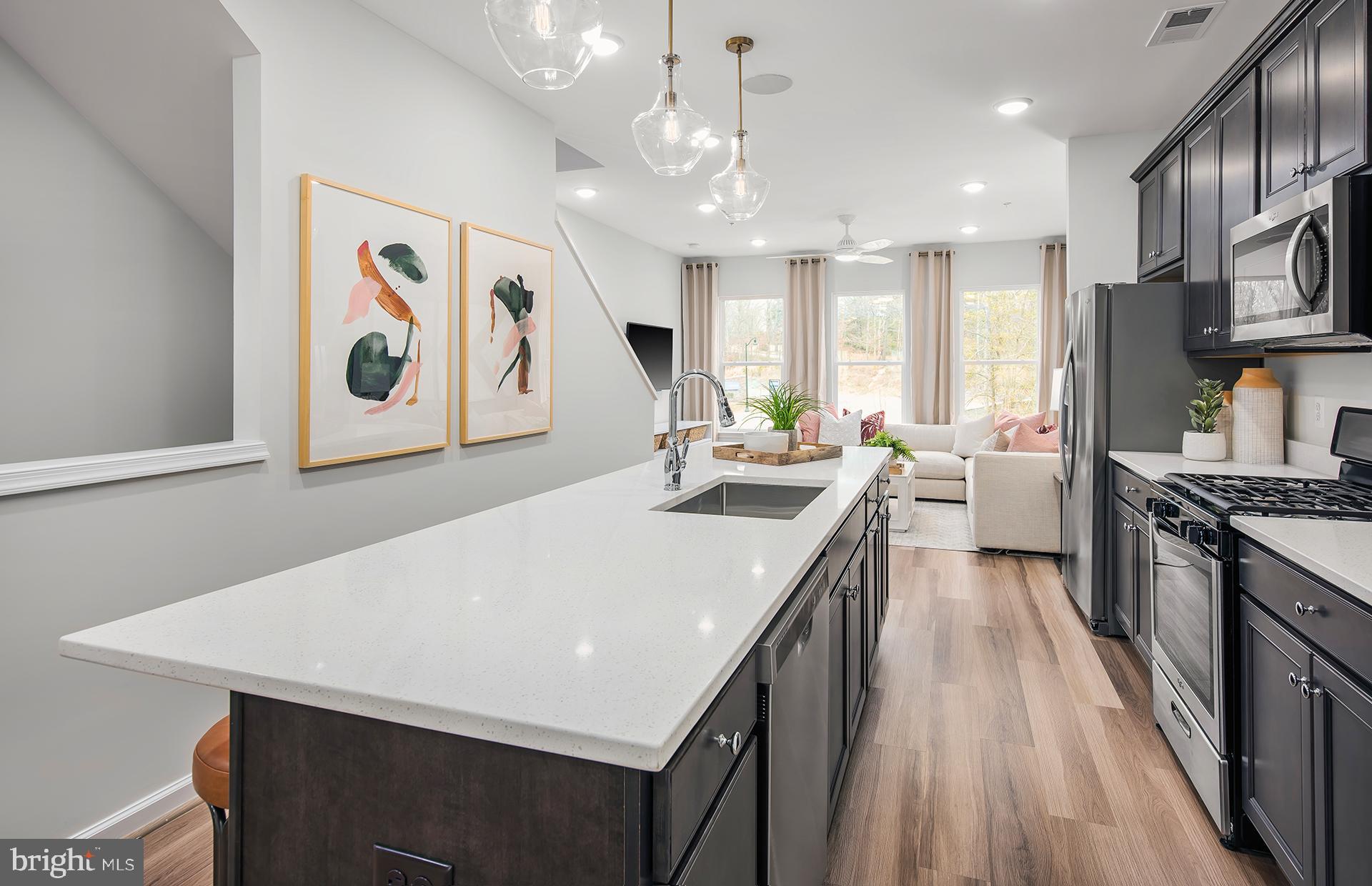 3227 Watershed Boulevard Laurel, MD 20724 - Photo 4 of 29 a kitchen with stainless steel appliances a stove a sink a refrigerator and a refrigerator
