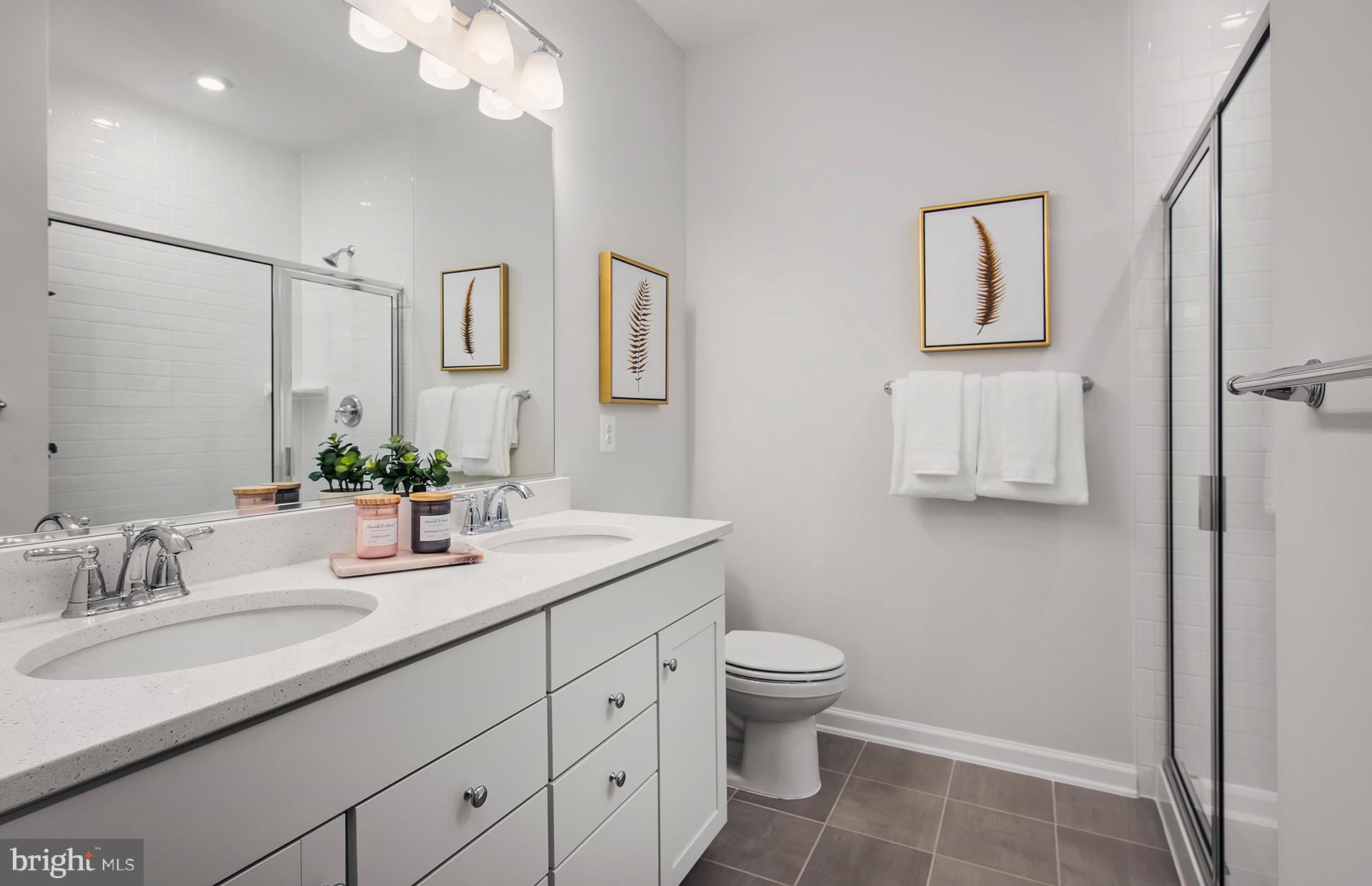 3227 Watershed Boulevard Laurel, MD 20724 - Photo 9 of 29 a bathroom with a granite countertop sink toilet and mirror