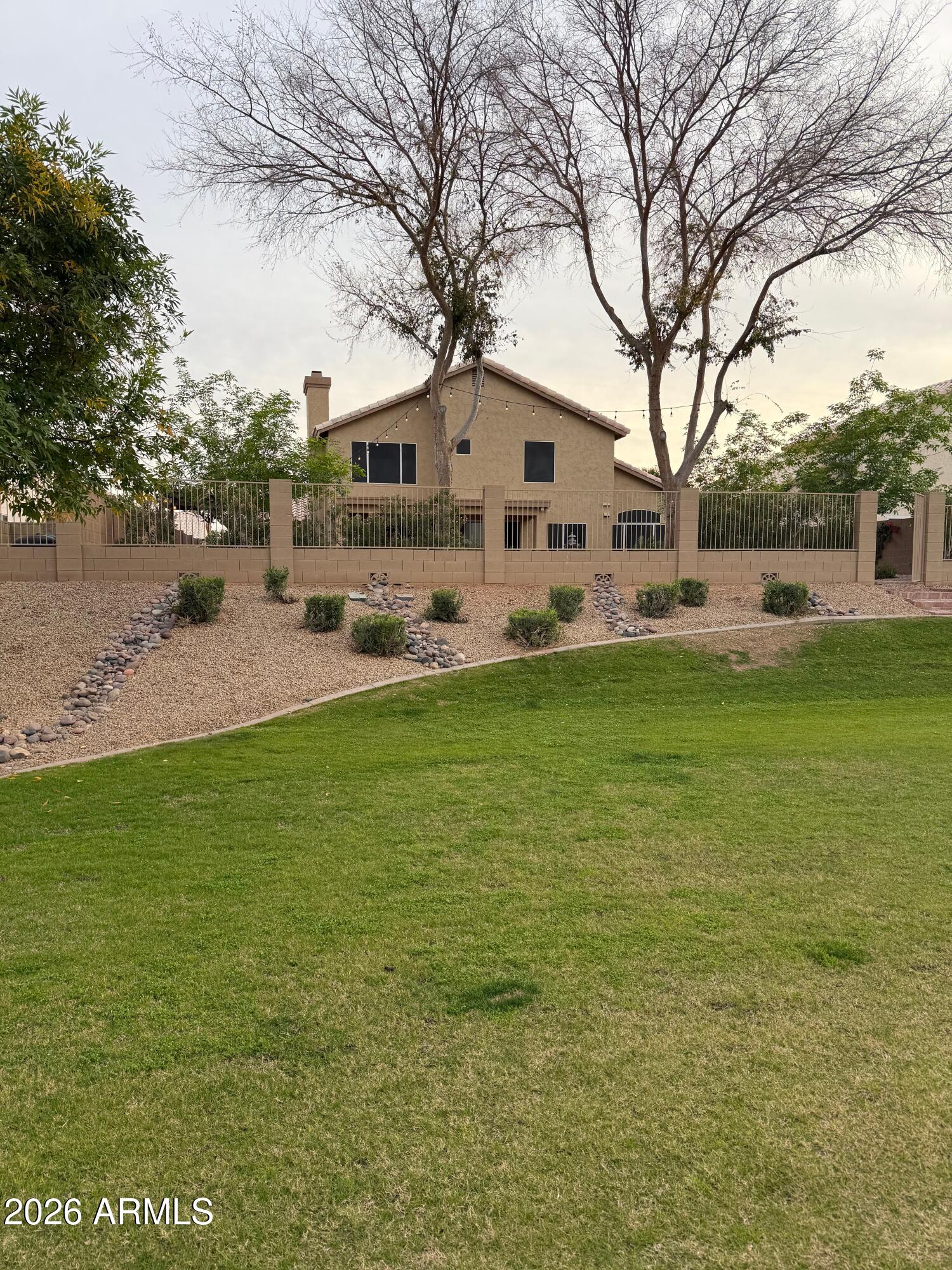 3426 East Clark Road Phoenix, AZ 85050 - Photo 47 of 48 a front view of house with yard and trees