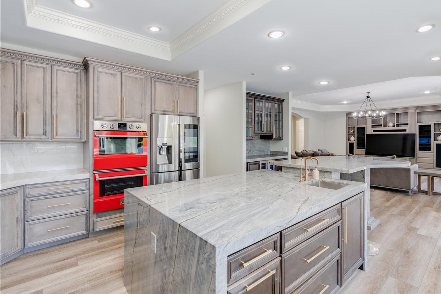 1940 Pear Drive Morgan Hill, CA 95037 - Photo 11 of 36 a kitchen with stainless steel appliances kitchen island granite countertop a refrigerator and a sink