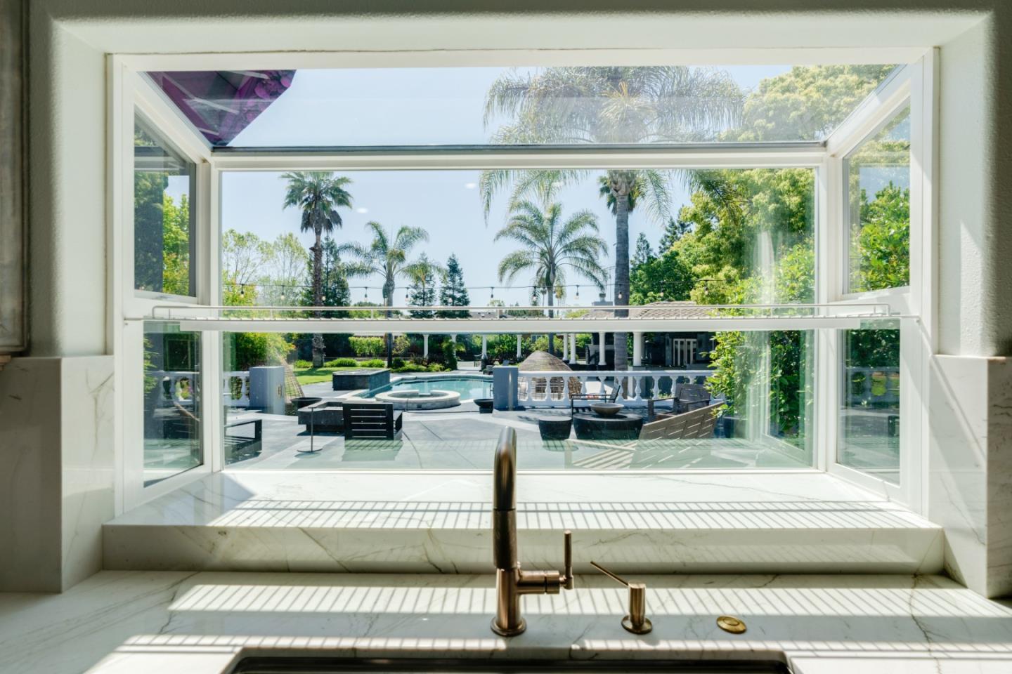 1940 Pear Drive Morgan Hill, CA 95037 - Photo 12 of 36 a living room with furniture and a large window