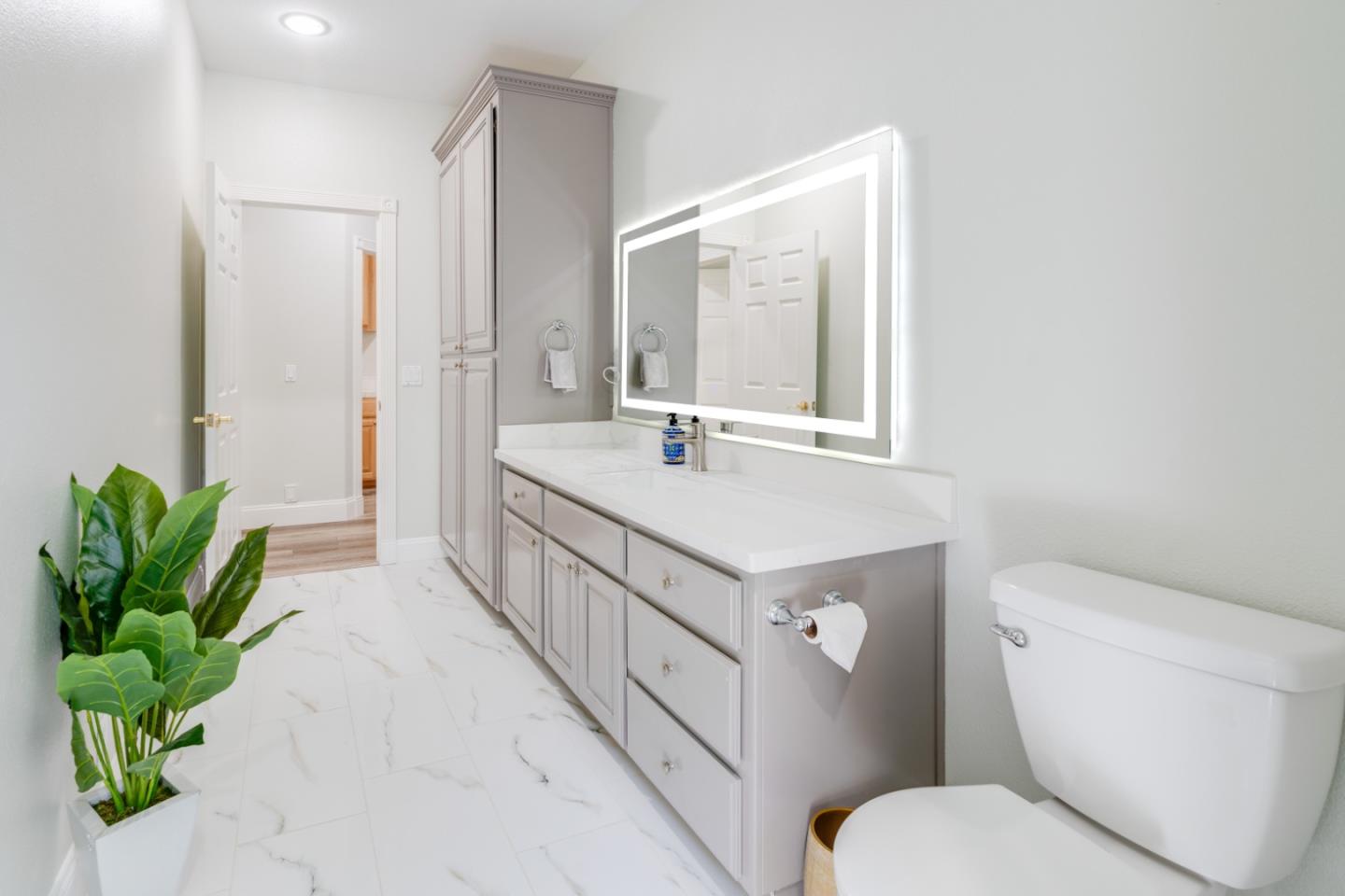 1940 Pear Drive Morgan Hill, CA 95037 - Photo 15 of 36 a bathroom with a sink a toilet and a mirror