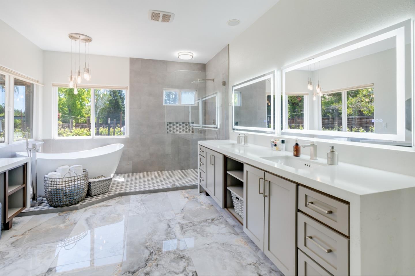 1940 Pear Drive Morgan Hill, CA 95037 - Photo 19 of 36 a spacious bathroom with a granite countertop sink large mirror and a bathtub