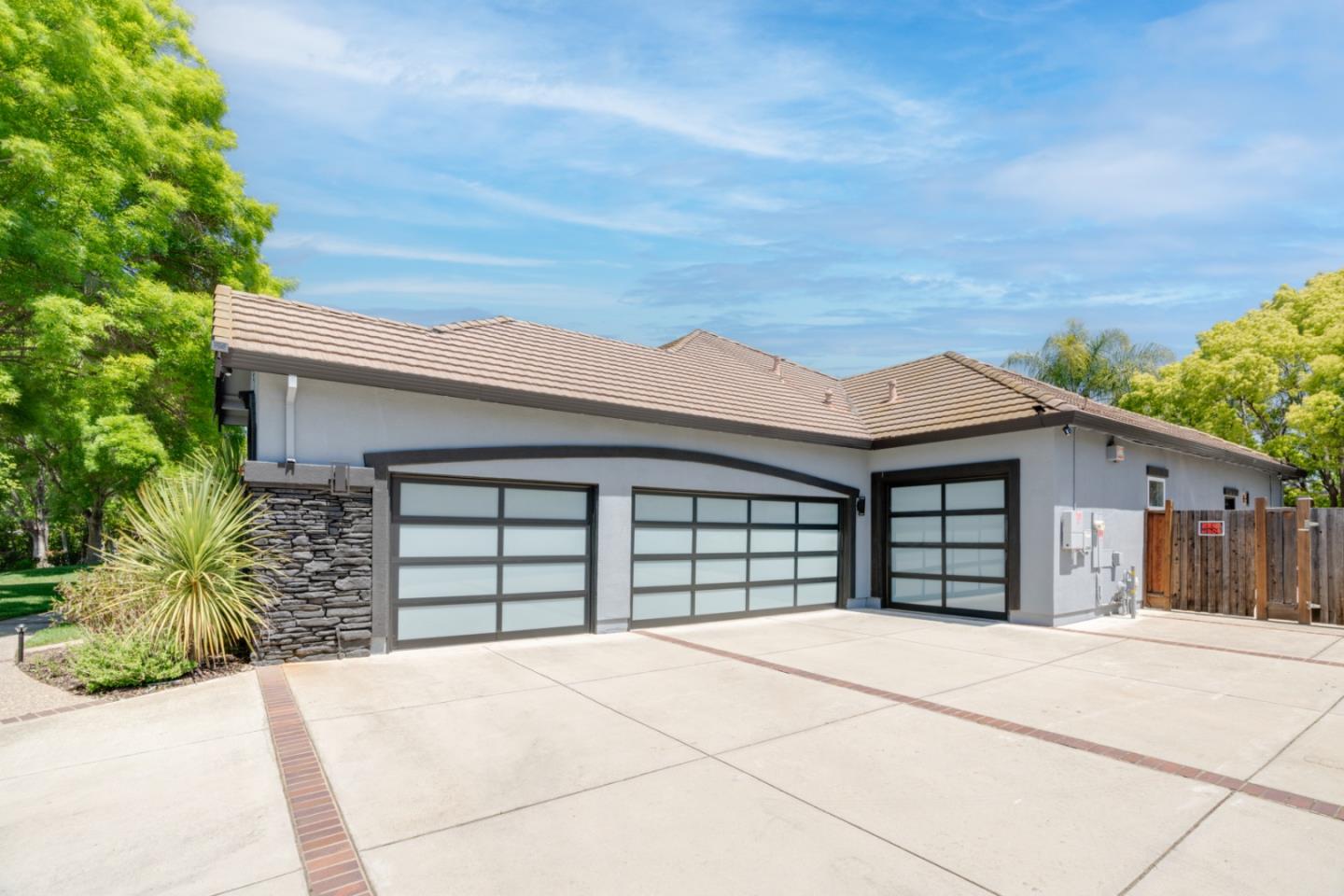 1940 Pear Drive Morgan Hill, CA 95037 - Photo 2 of 36 front view of a house with a garage