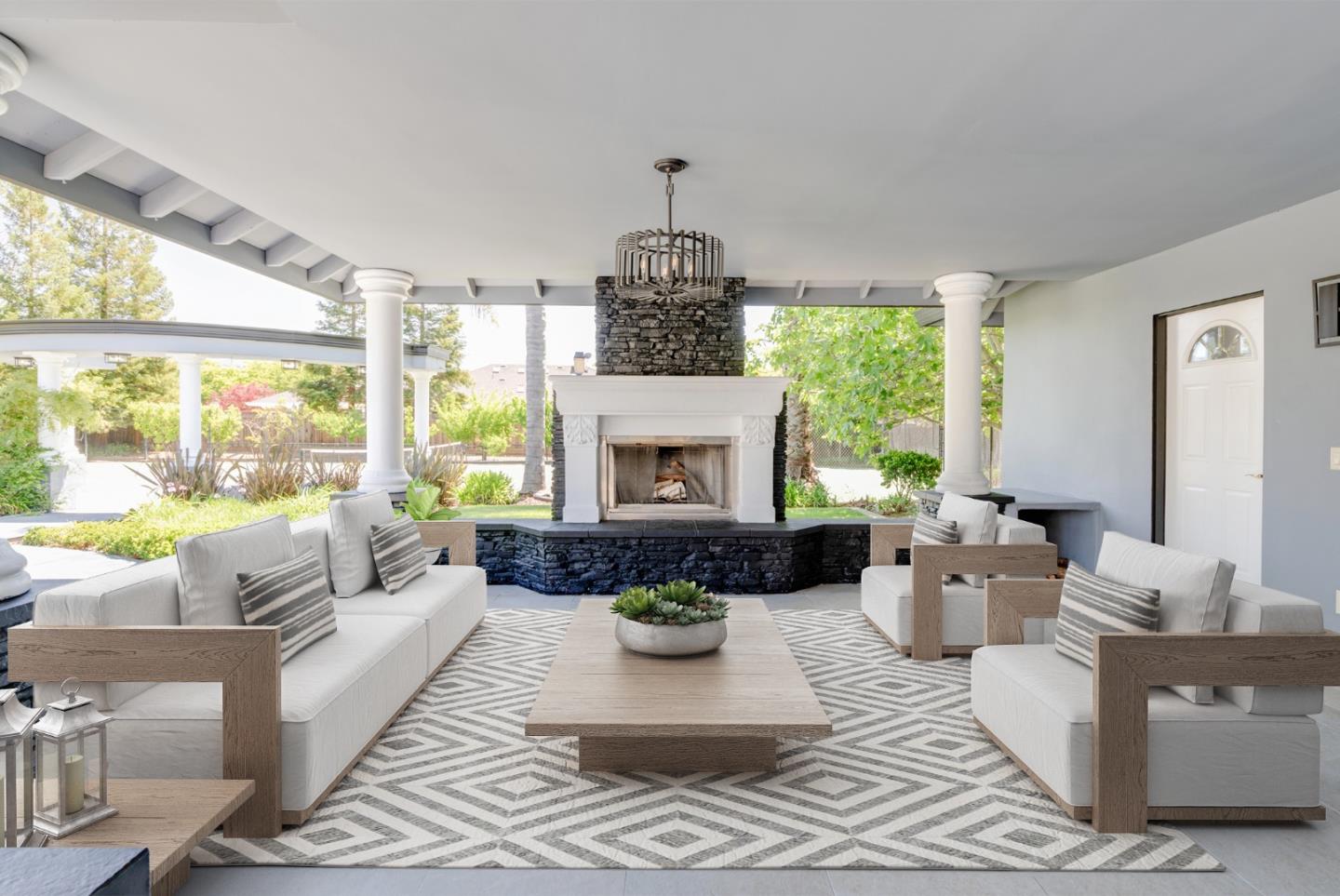 1940 Pear Drive Morgan Hill, CA 95037 - Photo 24 of 36 a living room with furniture a fireplace and a large window