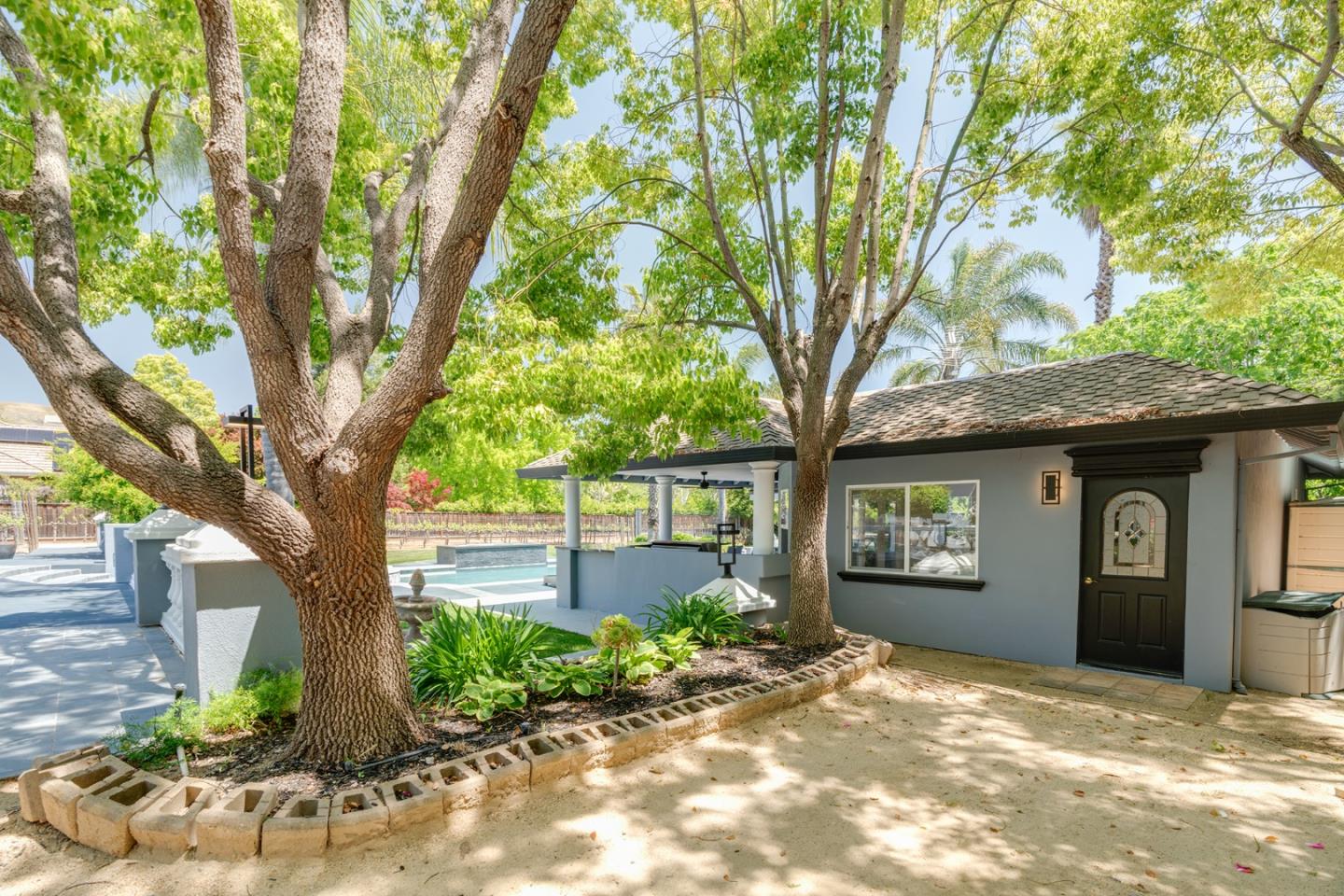 1940 Pear Drive Morgan Hill, CA 95037 - Photo 25 of 36 a front view of a house with garden