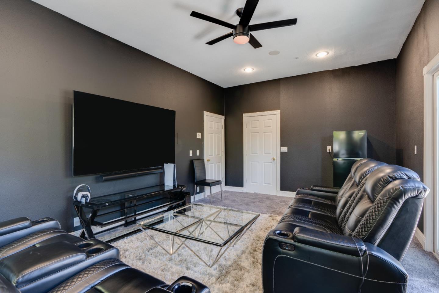 1940 Pear Drive Morgan Hill, CA 95037 - Photo 26 of 36 a living room with furniture and a flat screen tv
