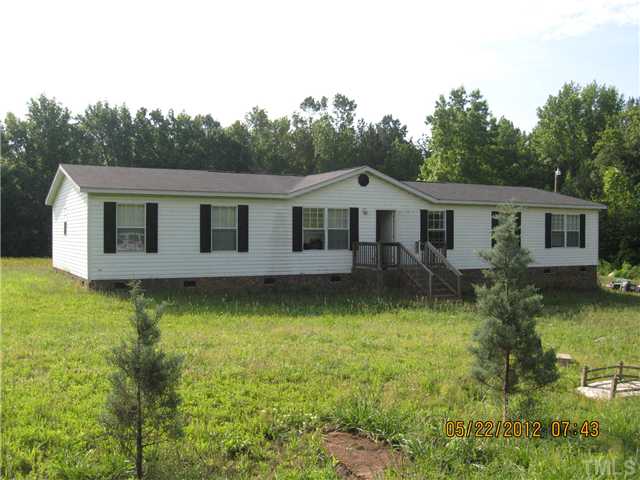 3255 Prophecy Road Middlesex, NC 27557 - Photo 1 of 3 a front view of a house with garden
