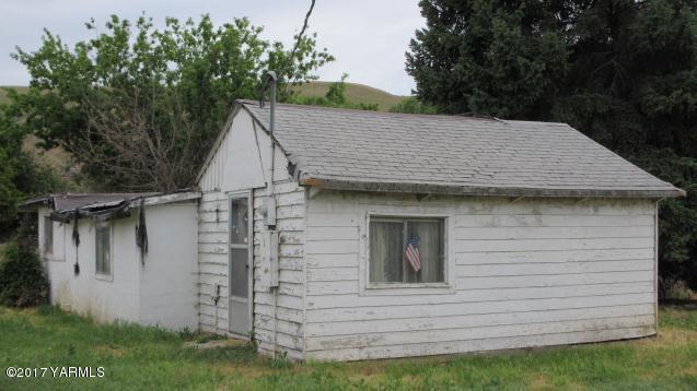 4410 Thorp Road Moxee, WA 98936 - Photo 6 of 6 a view of wooden house with a yard