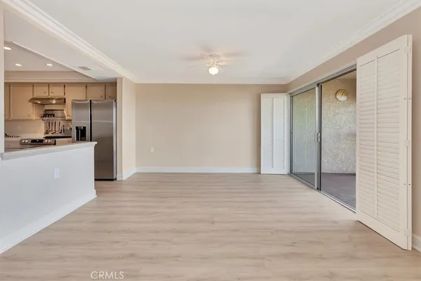 a view of a kitchen with a sink and cabinets