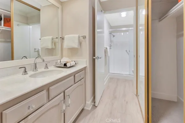 a bathroom with a double vanity sink and a mirror