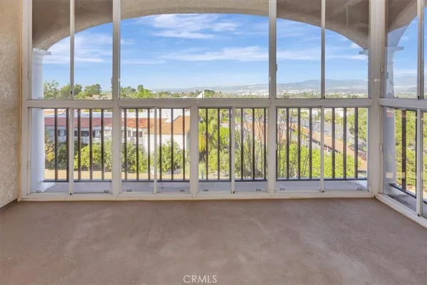 a view of a balcony with city view