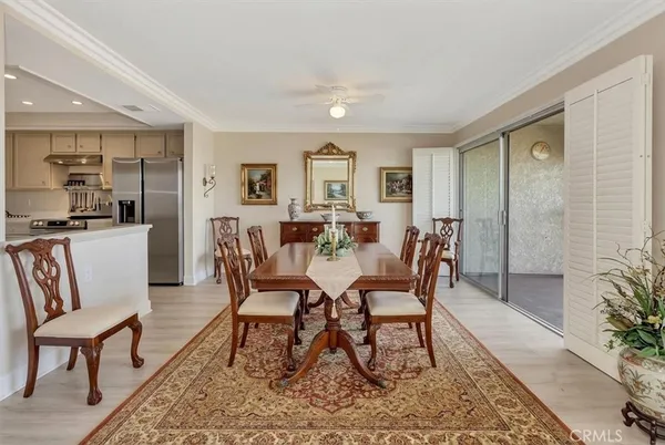 a dining room with furniture and window