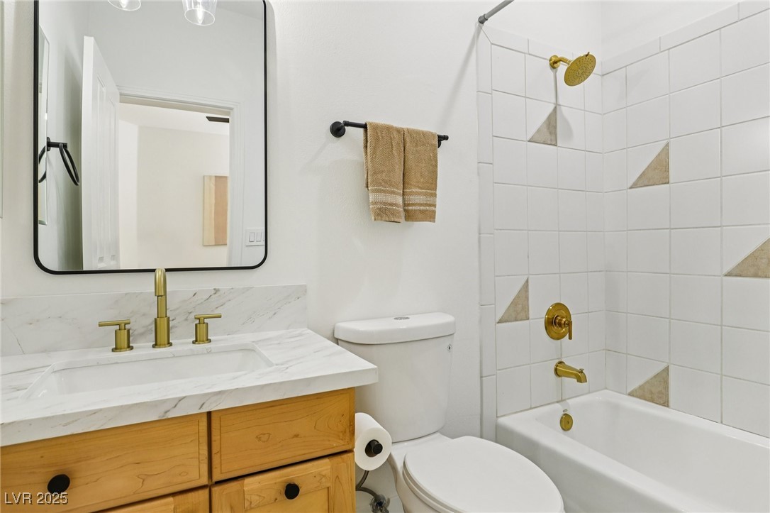 2469 Sun Reef Road Las Vegas, NV 89128 - Photo 64 of 93 Bathroom featuring vanity and shower / bathtub combination