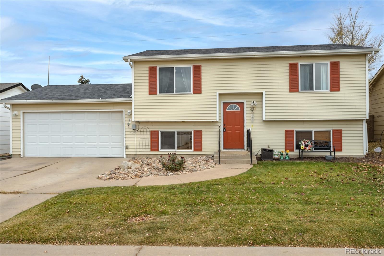 3192 West 3rd Street Road Greeley, CO 80631 - Photo 2 of 31 a front view of a house with a yard