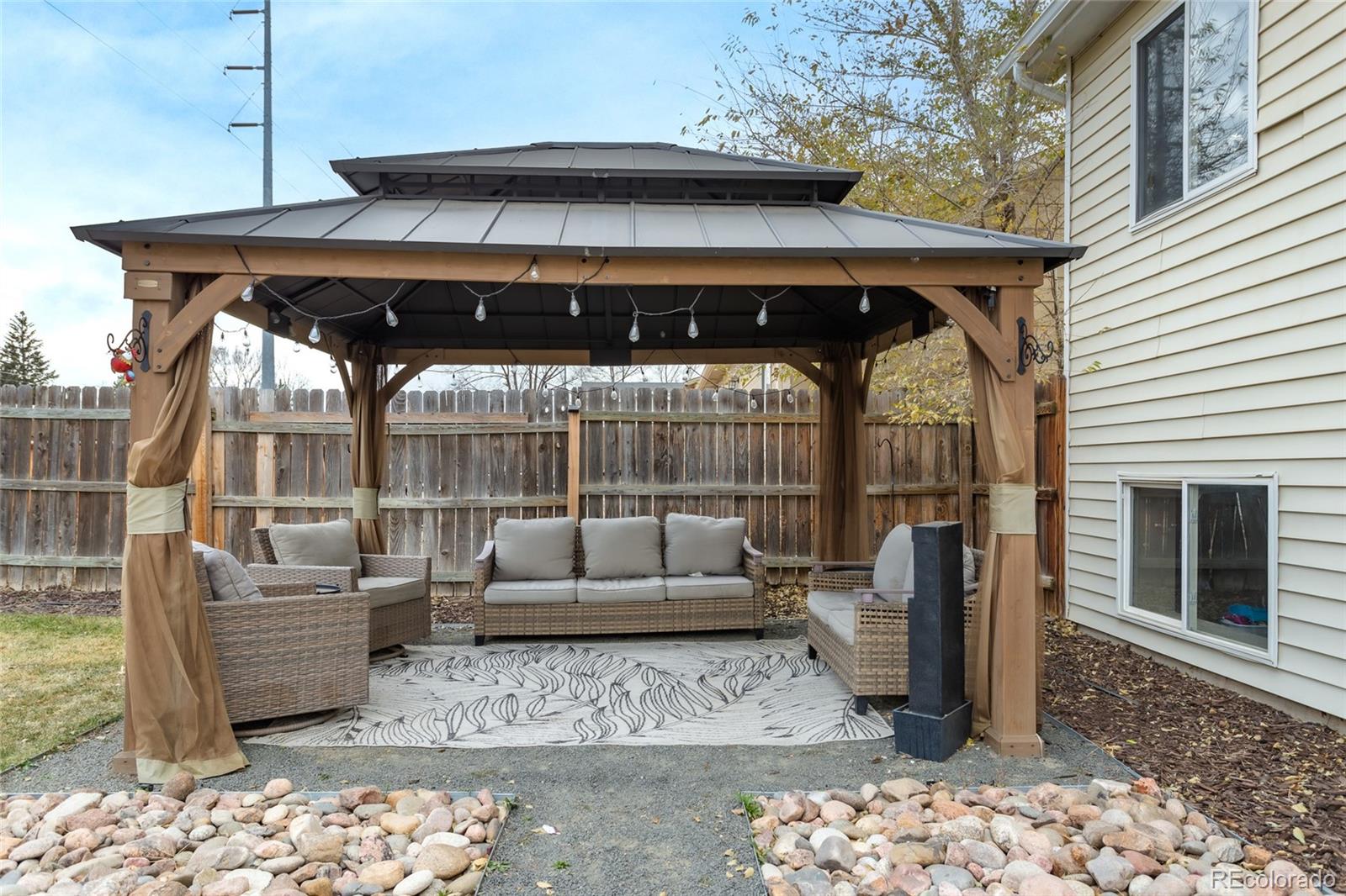 3192 West 3rd Street Road Greeley, CO 80631 - Photo 22 of 31 a view of a patio with couches chairs and potted plants