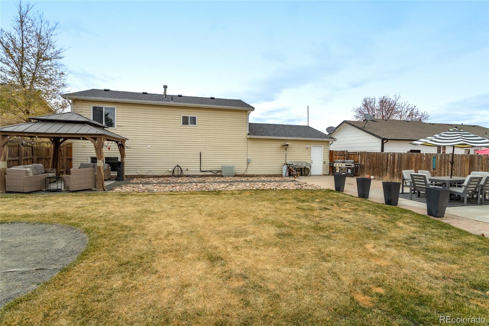 3192 West 3rd Street Road Greeley, CO 80631 - Photo 25 of 31 a front view of a house with yard and seating space