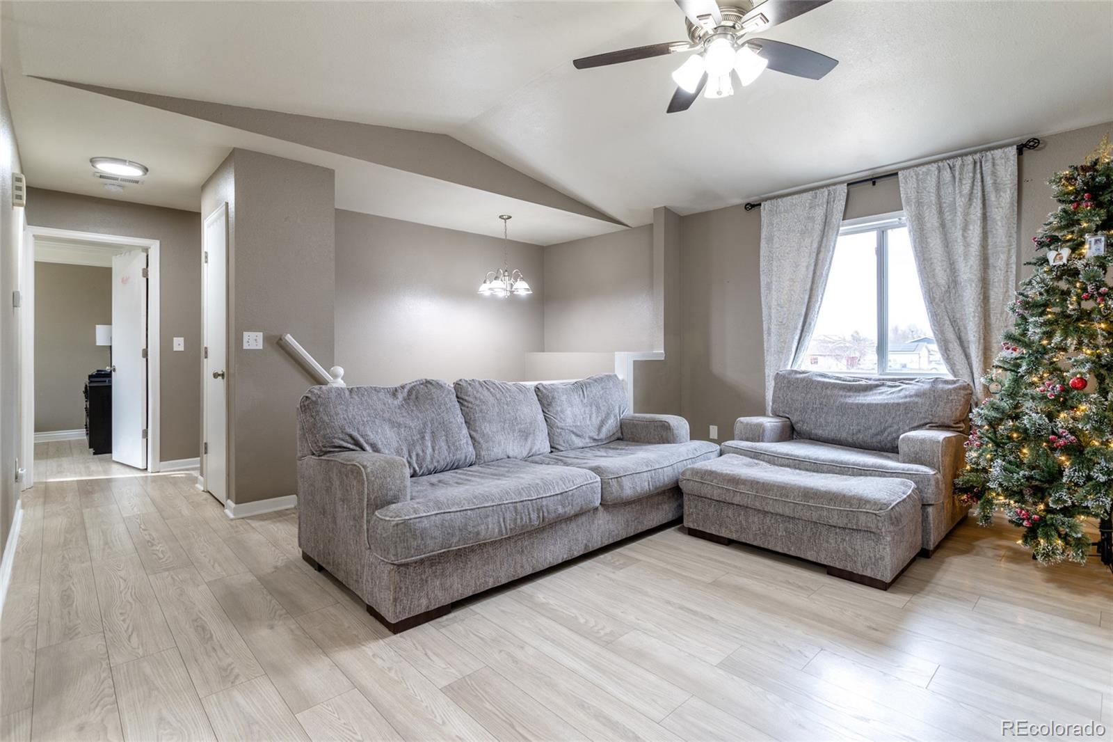 3192 West 3rd Street Road Greeley, CO 80631 - Photo 6 of 31 a living room with furniture and a large window