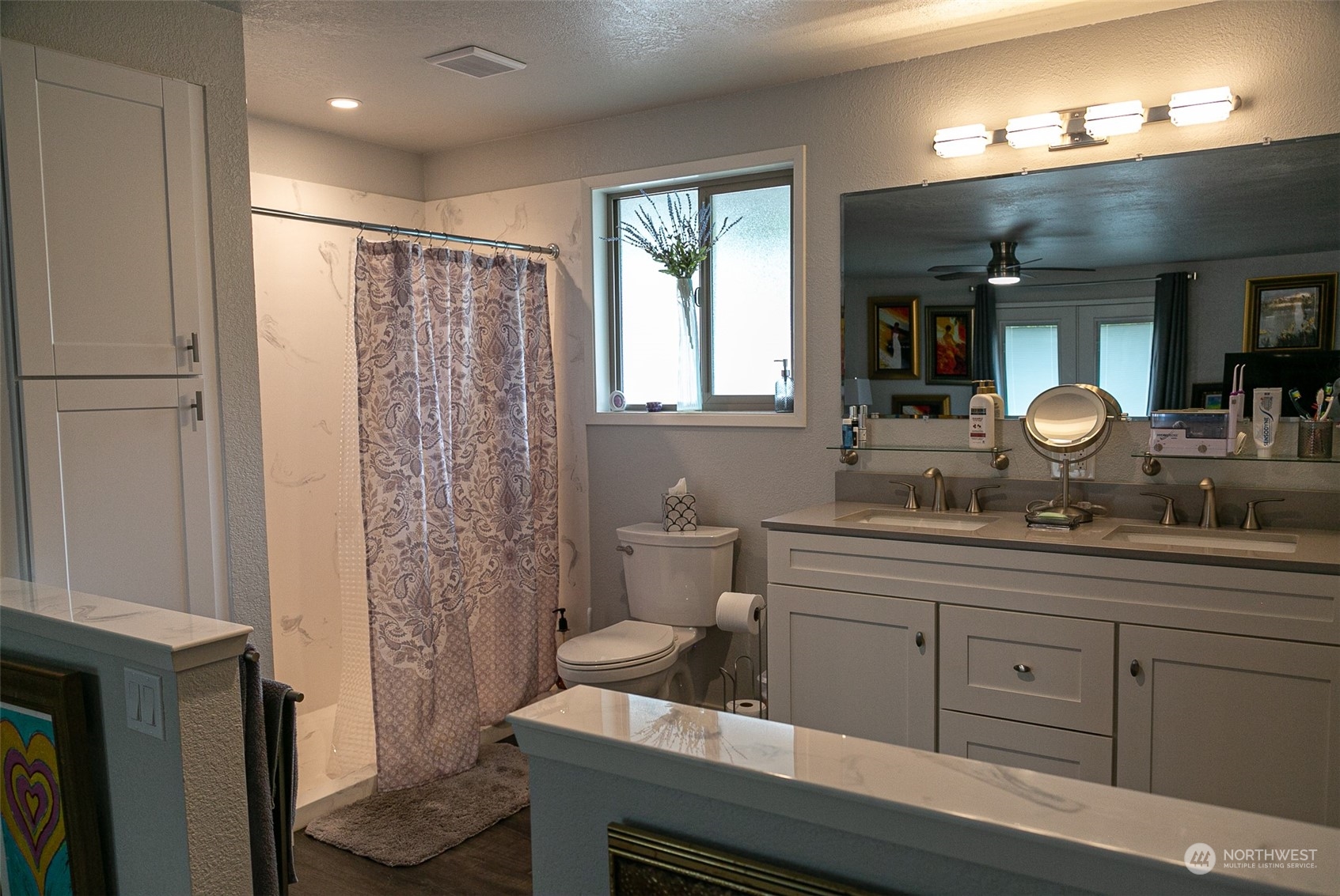 240 Osborn Road Port Angeles, WA 98362 - Photo 13 of 37 a spacious bathroom with double vanity and a mirror