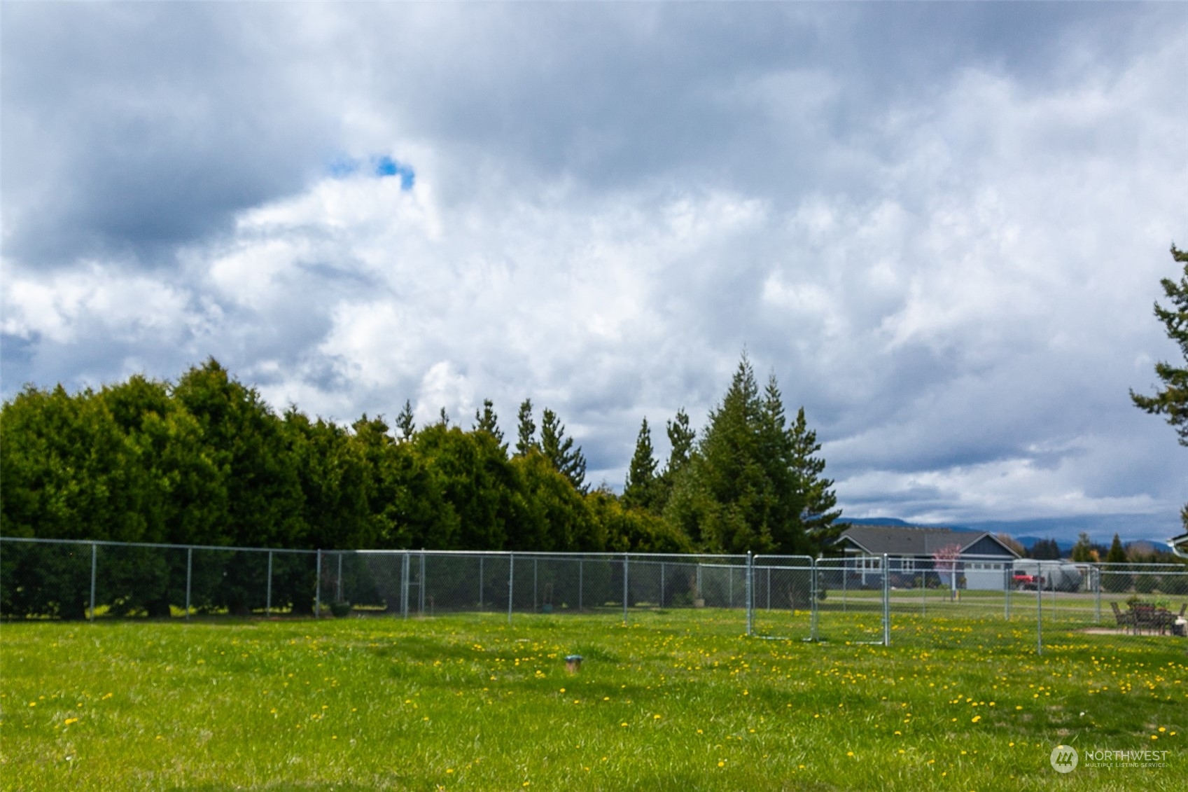240 Osborn Road Port Angeles, WA 98362 - Photo 36 of 37 a swimming pool with outdoor seating and garden