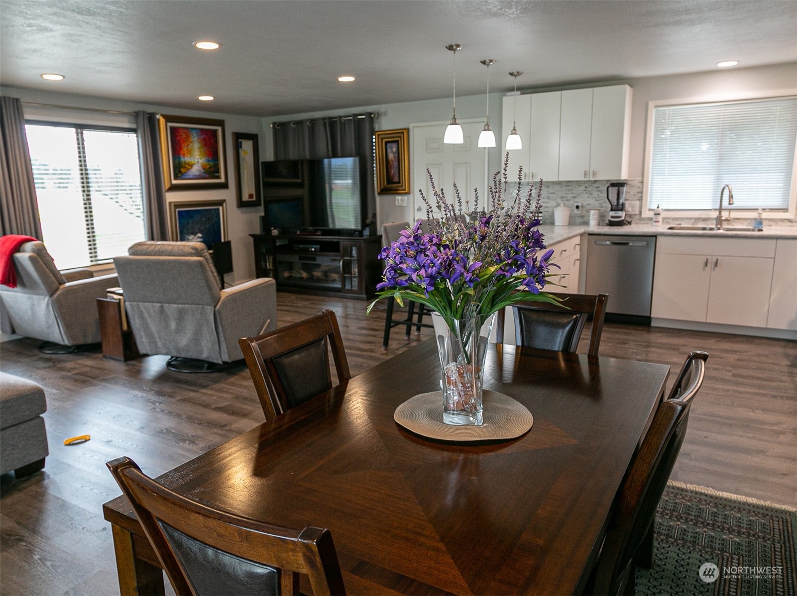 240 Osborn Road Port Angeles, WA 98362 - Photo 5 of 37 a kitchen with sink refrigerator dining table and chairs