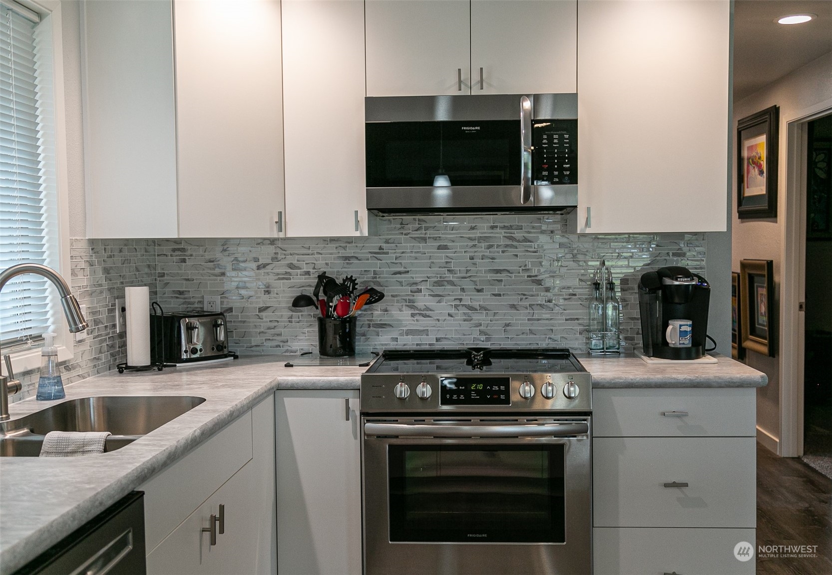 240 Osborn Road Port Angeles, WA 98362 - Photo 6 of 37 a kitchen with a stove and a microwave