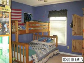 2160 Catoe Road Lancaster, SC 29720 - Photo 3 of 8 a bedroom with a bed and a window