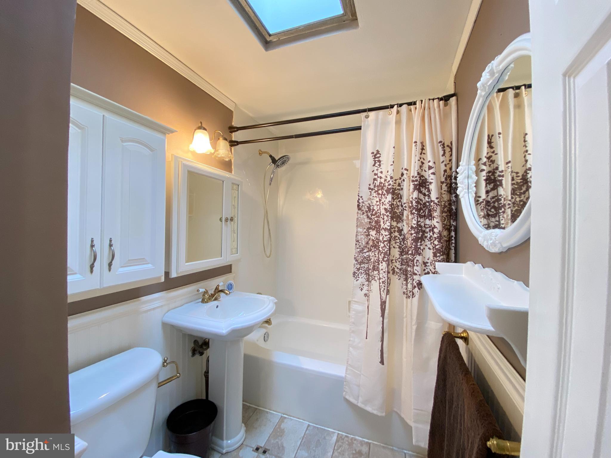 3209 Fairdale Road Philadelphia, PA 19154 - Photo 16 of 23 Tile floor & skylight