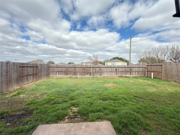 a view of a backyard with a garden