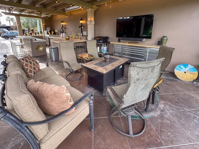 a living room with furniture and flat screen tv